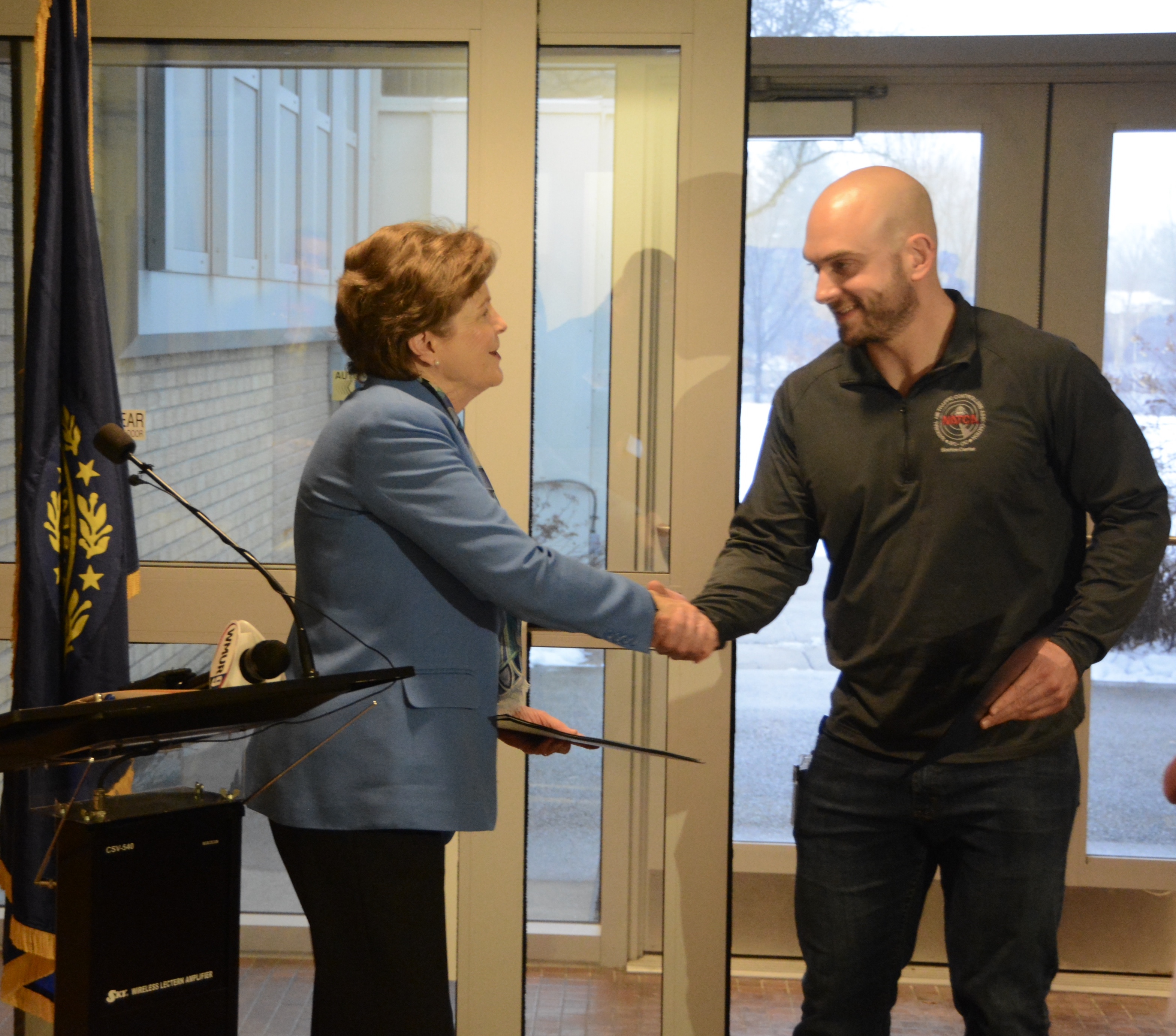 Senator Shaheen presents CR Statement to Michael Jacobson