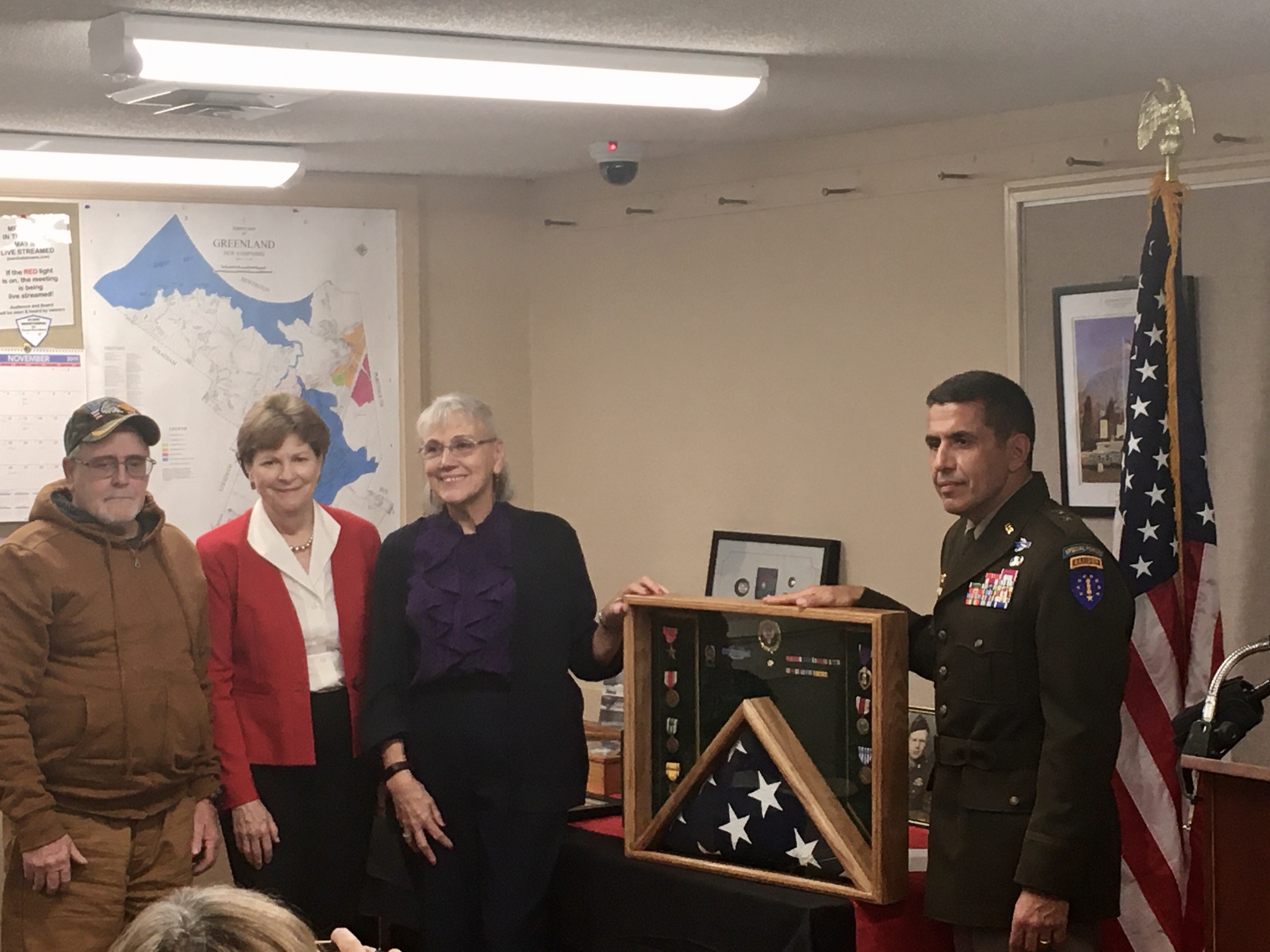 Shaheen with son and daughter of World War II veteran Carlton Farrand, and General David J. Mikolaities, The Adjutant General, New Hampshire